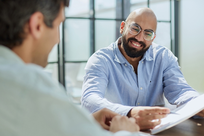 Startup,Partners,Discussing,Project,At,Laptop,,Watching,Video,Presentation